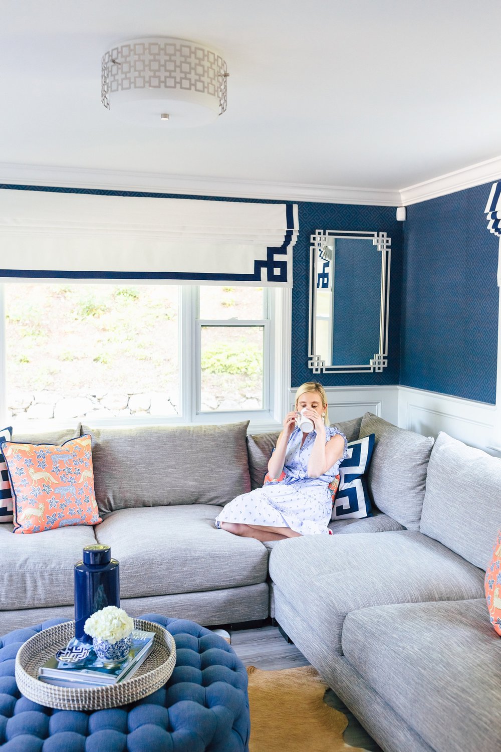 modern living room drinking tea on a sofa