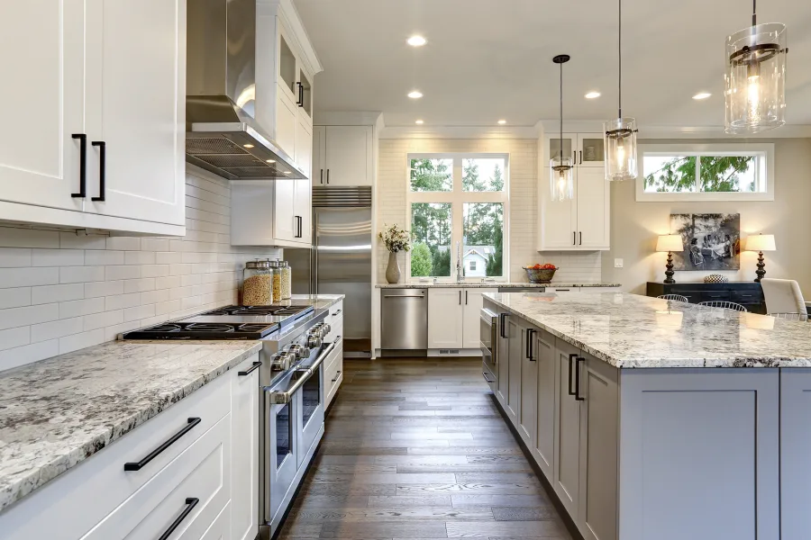 white kitchen cabinets and brown vinyl floor from Johnson & Sons Flooring in Knoxville, TN